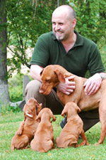 Pavel Unverdorben with puppies